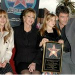 Dakota Johnson with her mother, stepfather and sister