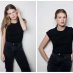 Sofia Ernst stands in a black T-shirt near the wall