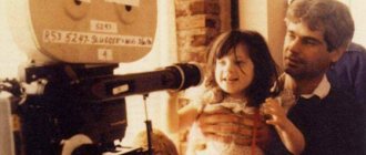 Zooey Deschanel as a child with her father on set